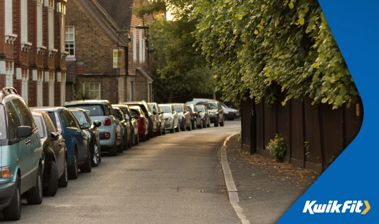 row of cars parked on the street